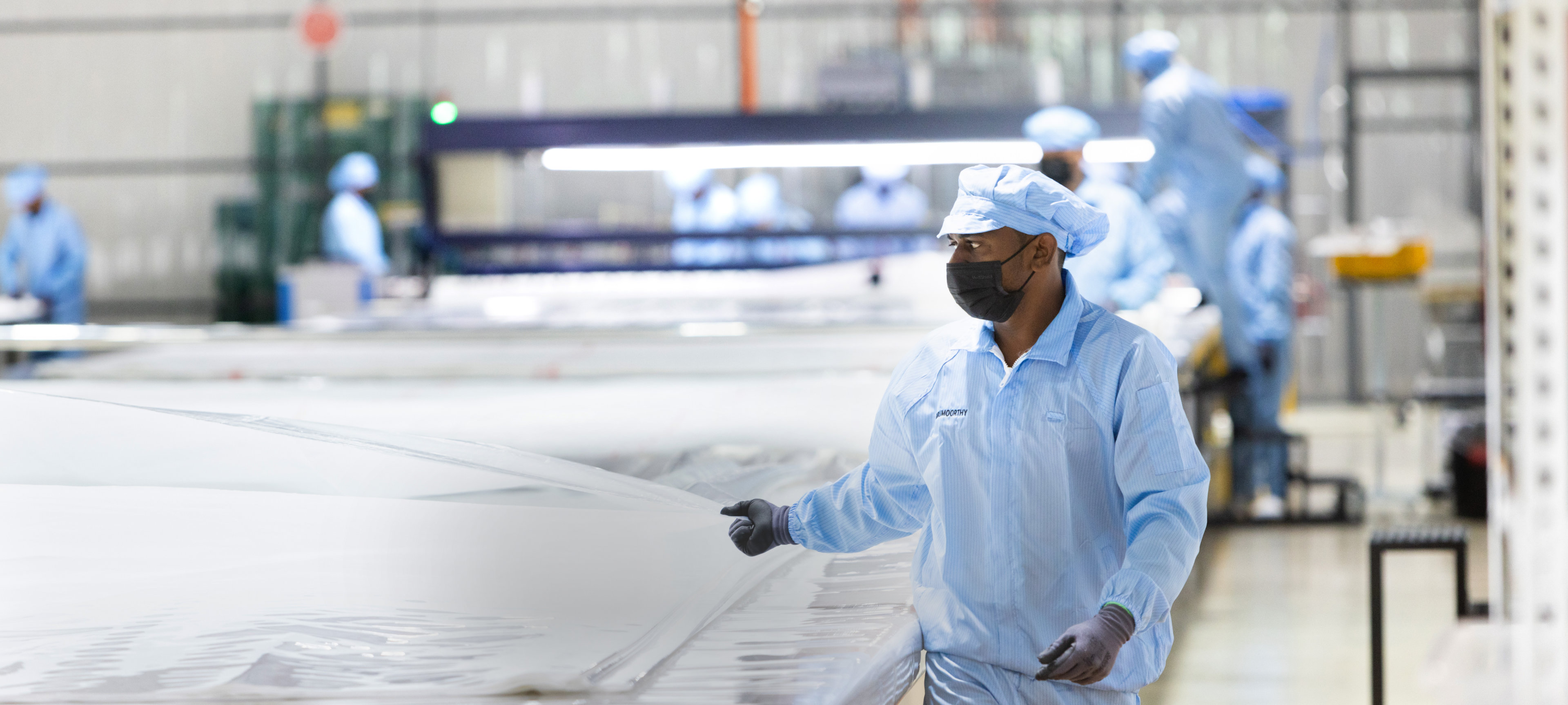 People working in the Powertex production hall