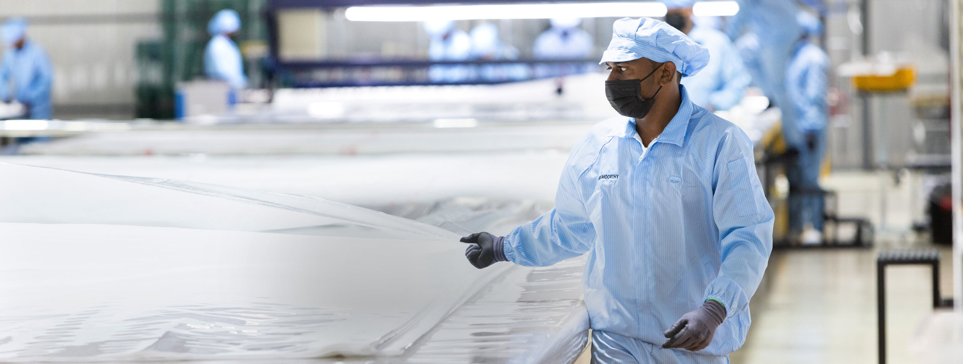 People working in the Powertex production hall